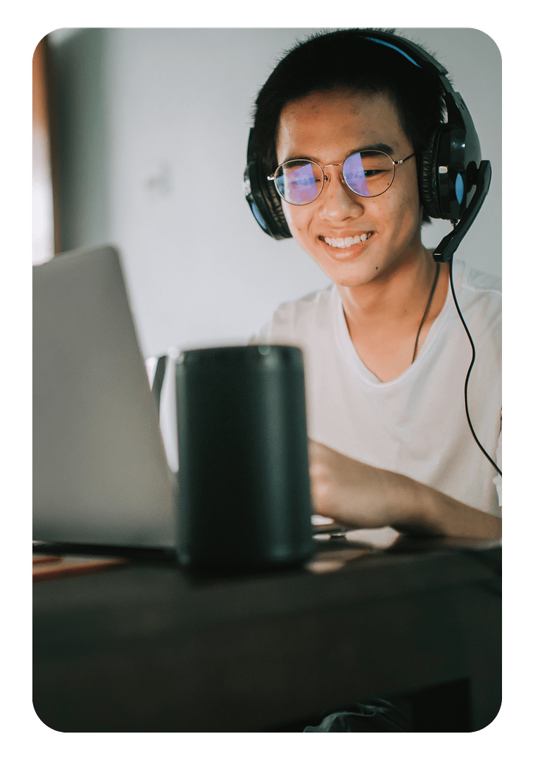 asian man with headphones and laptop